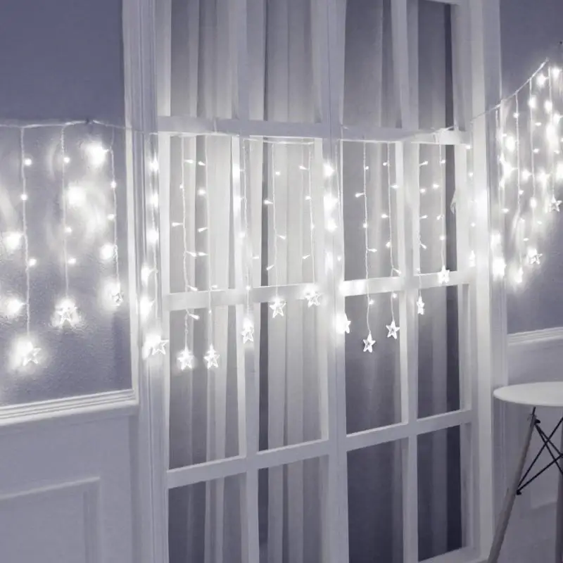Rideau lumineux Etoiles 100LED IP44 2×0.7M – câble transparent, BLANC FROID Must-Have